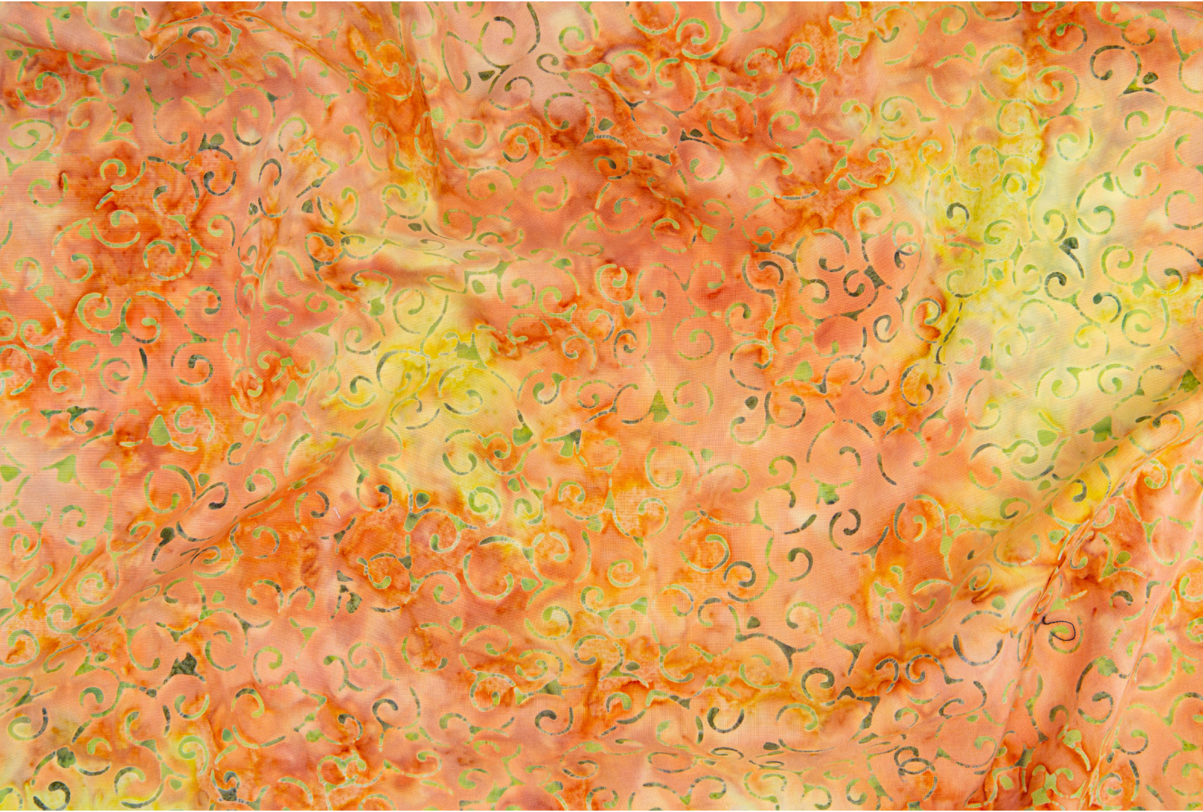 Scroll – Citrus batik fabric by Jinny Beyer - energetic scroll motif on bright citrus cotton.