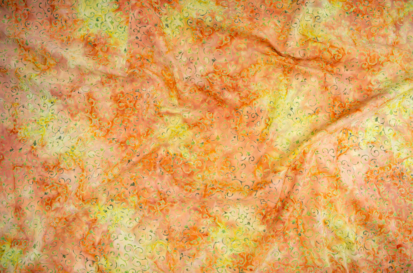 Scroll – Citrus batik fabric by Jinny Beyer - energetic scroll motif on bright citrus cotton.