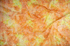 Scroll – Citrus batik fabric by Jinny Beyer - energetic scroll motif on bright citrus cotton.