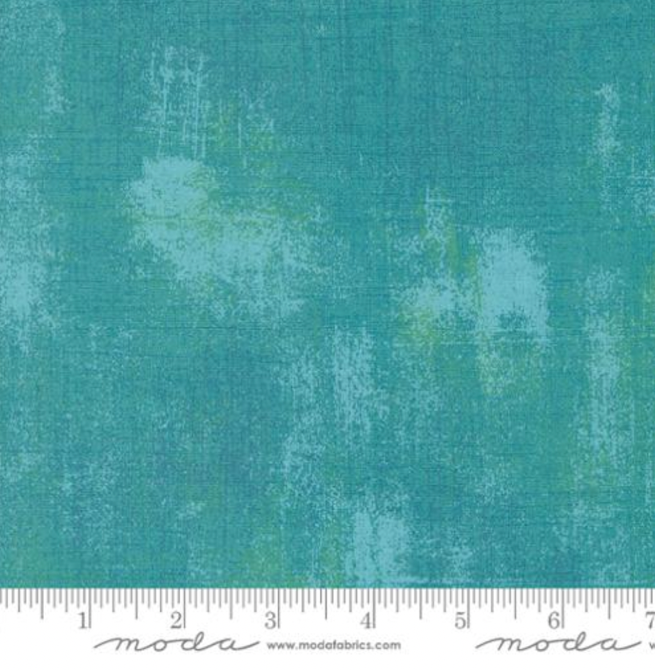 Close-up of Grunge Basics Mint Tea Fabric by BasicGrey for Moda Fabrics featuring textured mint green cotton print.