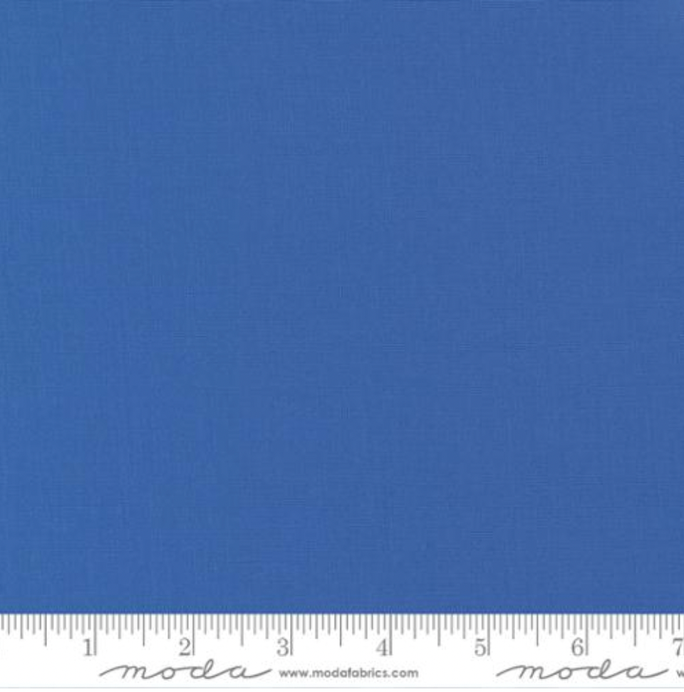Bella Solids Cobalt Fabric by Moda Fabrics – deep blue 100% cotton quilting fabric with smooth texture and bold color.