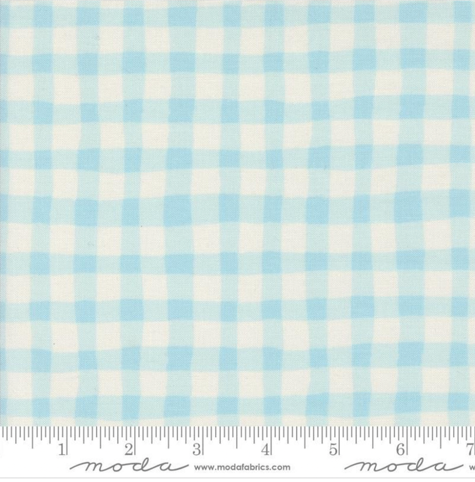 Emmitt and Ivy Gingham Sky Fabric by Sweetwater for Moda Fabrics – soft blue and white watercolor-style gingham 100% cotton fabric with smooth texture.