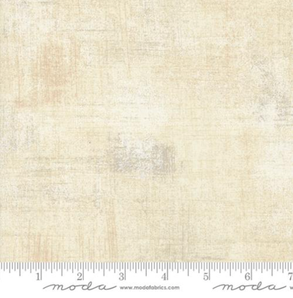 Close-up of Grunge Basics Spritzer Fabric by BasicGrey for Moda Fabrics showing soft beige textured cotton with tonal distressed design.