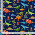 Colorful dinosaur scenic cotton fabric with volcanoes and palm trees on navy background by Timeless Treasures