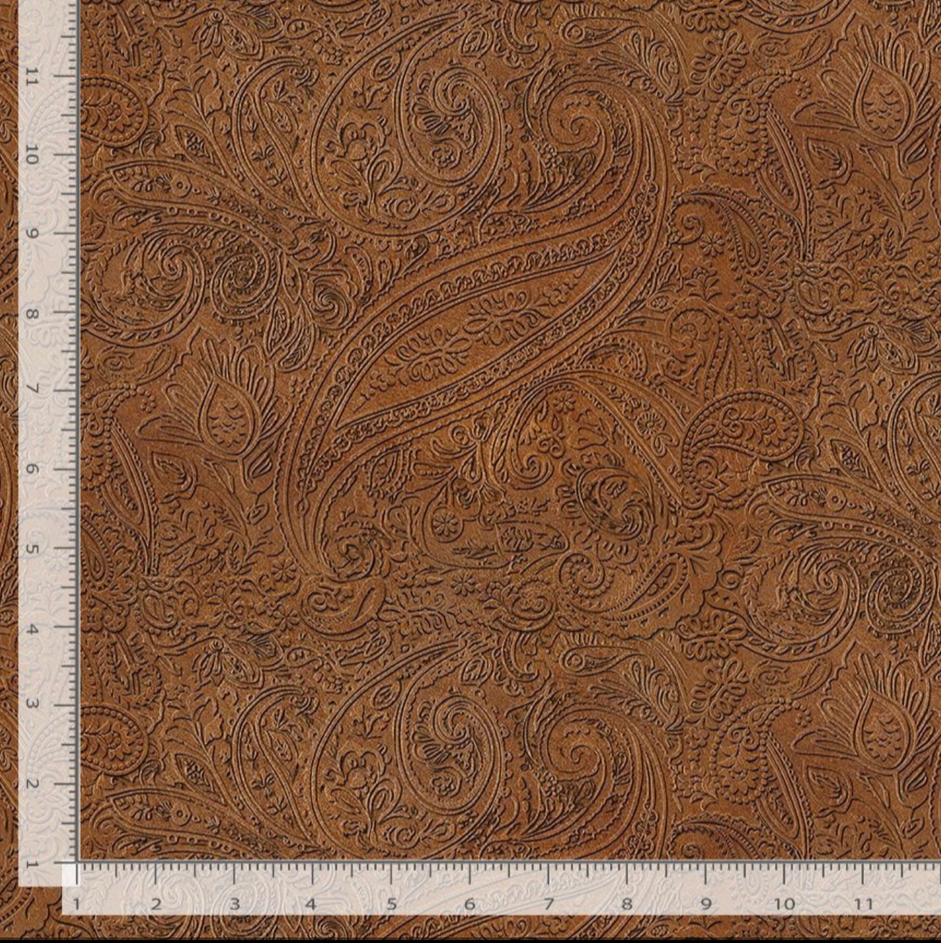 Western tooled leather style paisley cotton fabric in rich brown tones by Timeless Treasures