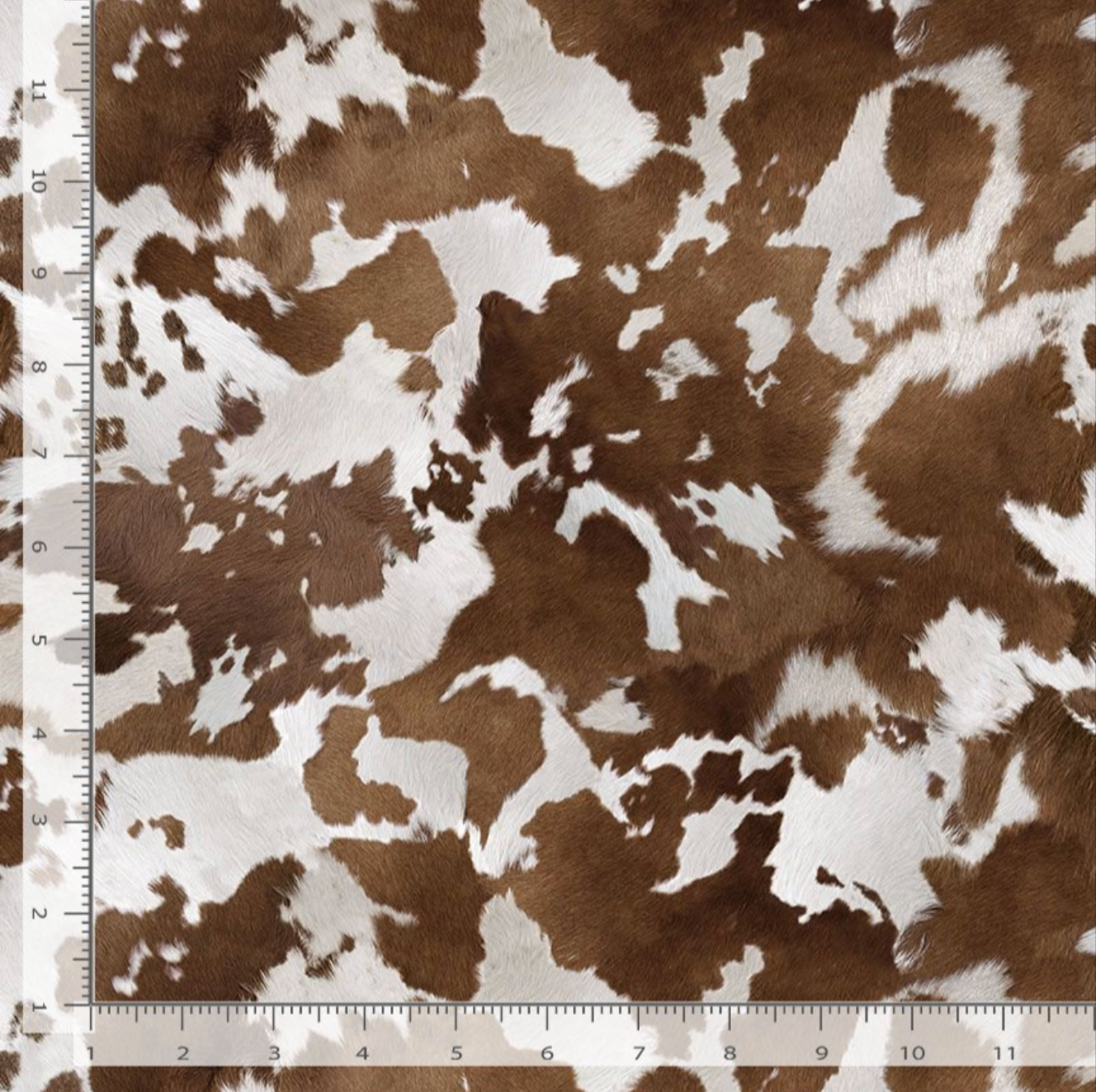 Realistic brown and white cowhide ponyskin print cotton fabric by Timeless Treasures