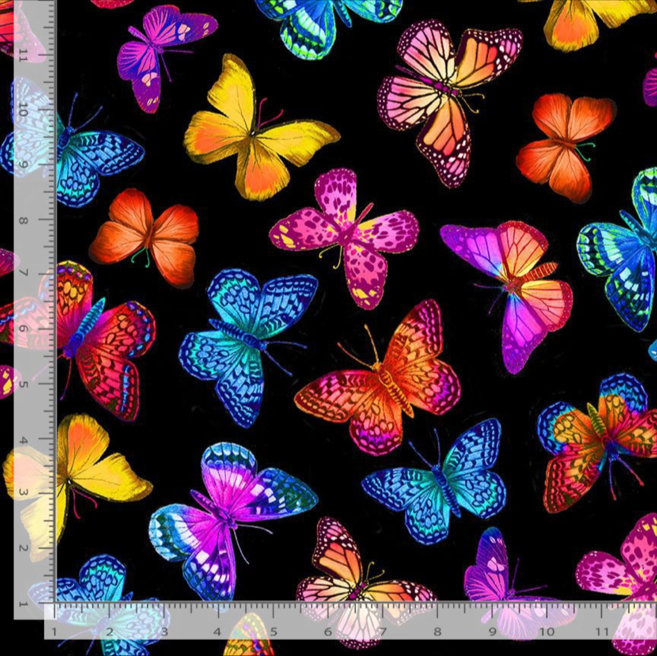 Colorful butterflies flying across black wide backing cotton fabric by Timeless Treasures
