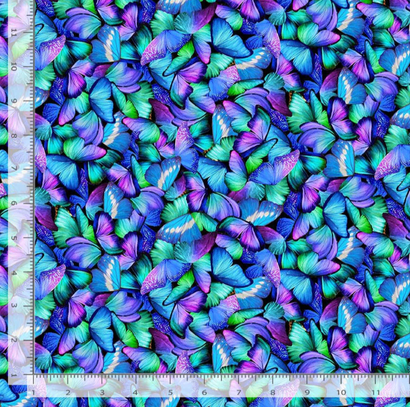 Packed blue, teal, turquoise, and purple butterflies layered across a vibrant cotton fabric background