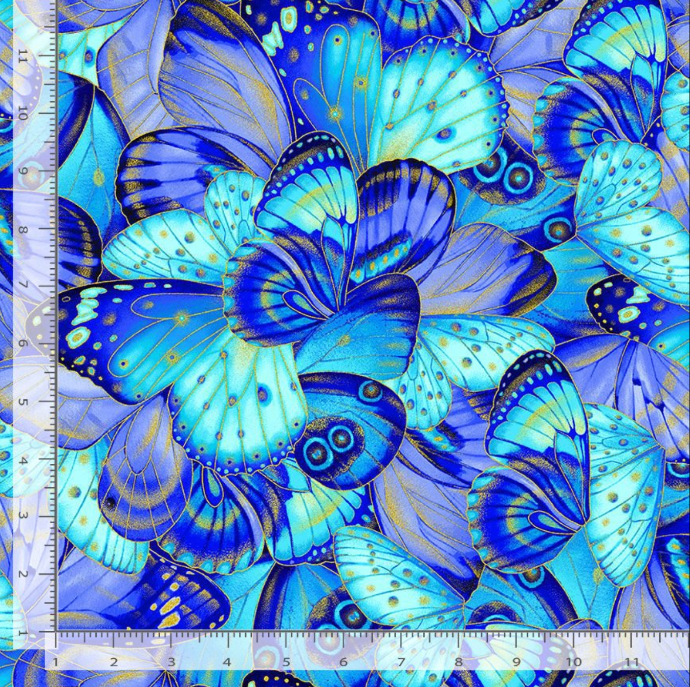 Blue, aqua, and lavender butterfly wings with metallic gold accents layered across a vibrant cotton background by Timeless Treasures.
