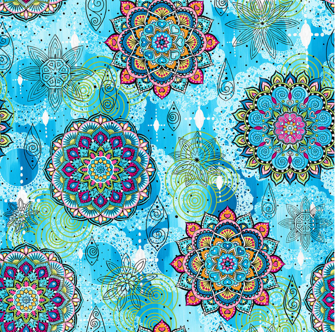 Colorful mandala fabric featuring vibrant floral medallions in jewel tones on a textured blue background by Blank Quilting.