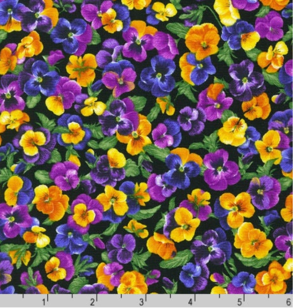 Colorful purple, yellow, and orange pansies packed on a black background fabric by Debbie Beaves for Robert Kaufman.