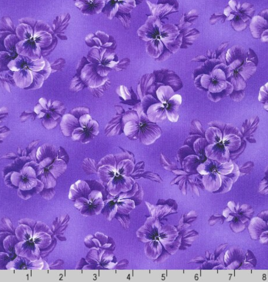 Purple floral cotton fabric featuring tonal pansies and blossoms in lavender and violet shades by Debbie Beaves for Robert Kaufman.