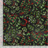 Christmas cotton fabric featuring mistletoe sprigs, holly leaves, red berries, evergreen branches, and red ribbon bows on a black background from the Peace Joy & Love collection by Timeless Treasures.