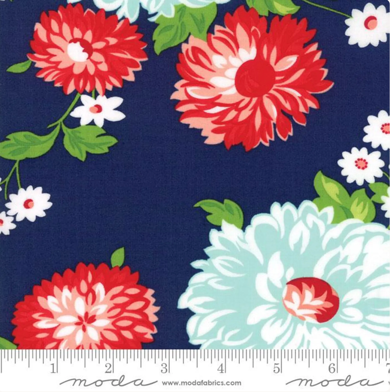The Good Life Floral Navy fabric by Bonnie & Camille for Moda Fabrics featuring oversized coral red, aqua, and white flowers with green leaves on a navy blue background.