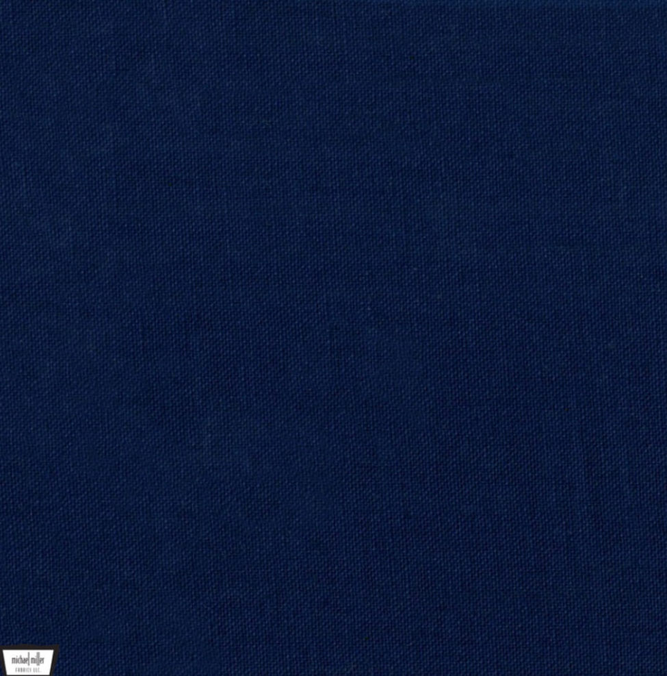 Solid dark navy blue quilting cotton fabric from the Cotton Couture collection by Michael Miller Fabrics, featuring a rich cadet blue color suitable for quilts, apparel, and sewing projects.