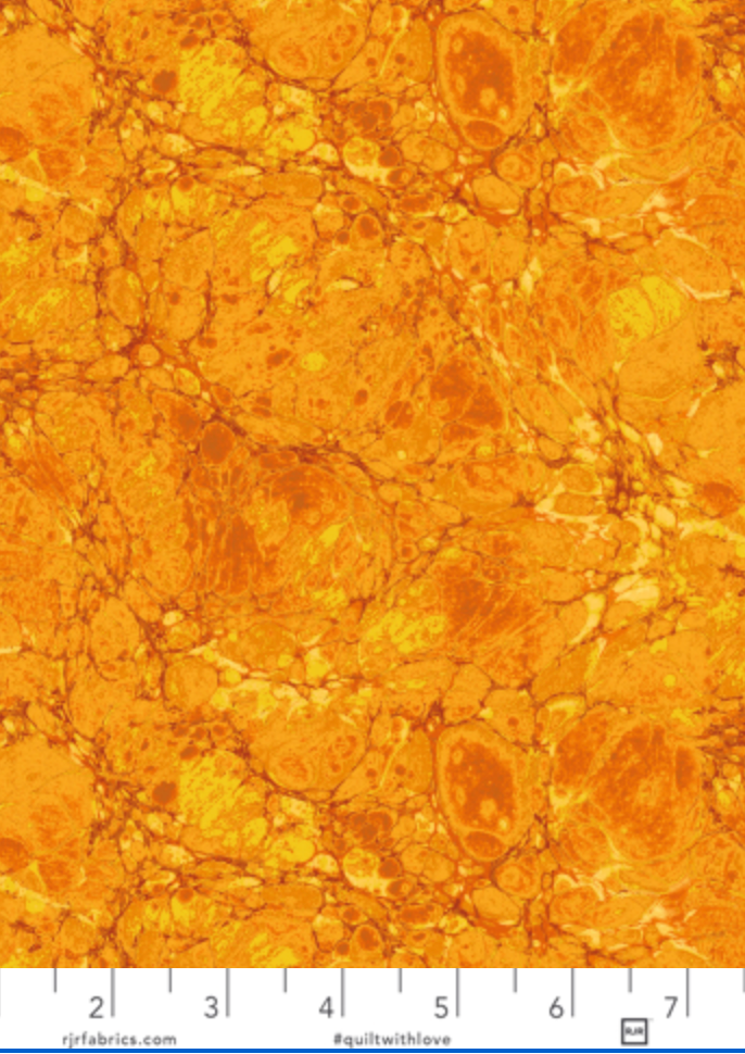 The Jinny Beyer Palette Granite Topaz cotton fabric by Jinny Beyer for RJR Fabrics featuring marbled golden stone textures in rich amber and topaz tones.