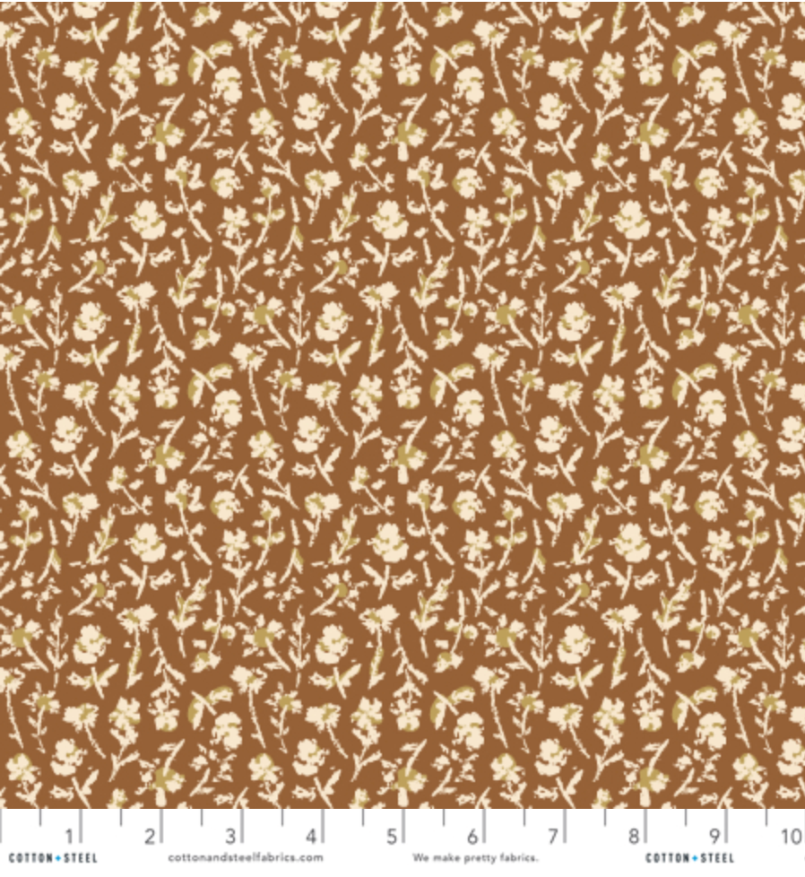 Summer Folk Little Florets Earth cotton fabric by Lissie Teehee for Cotton + Steel featuring delicate cream wildflowers on a warm brown background.