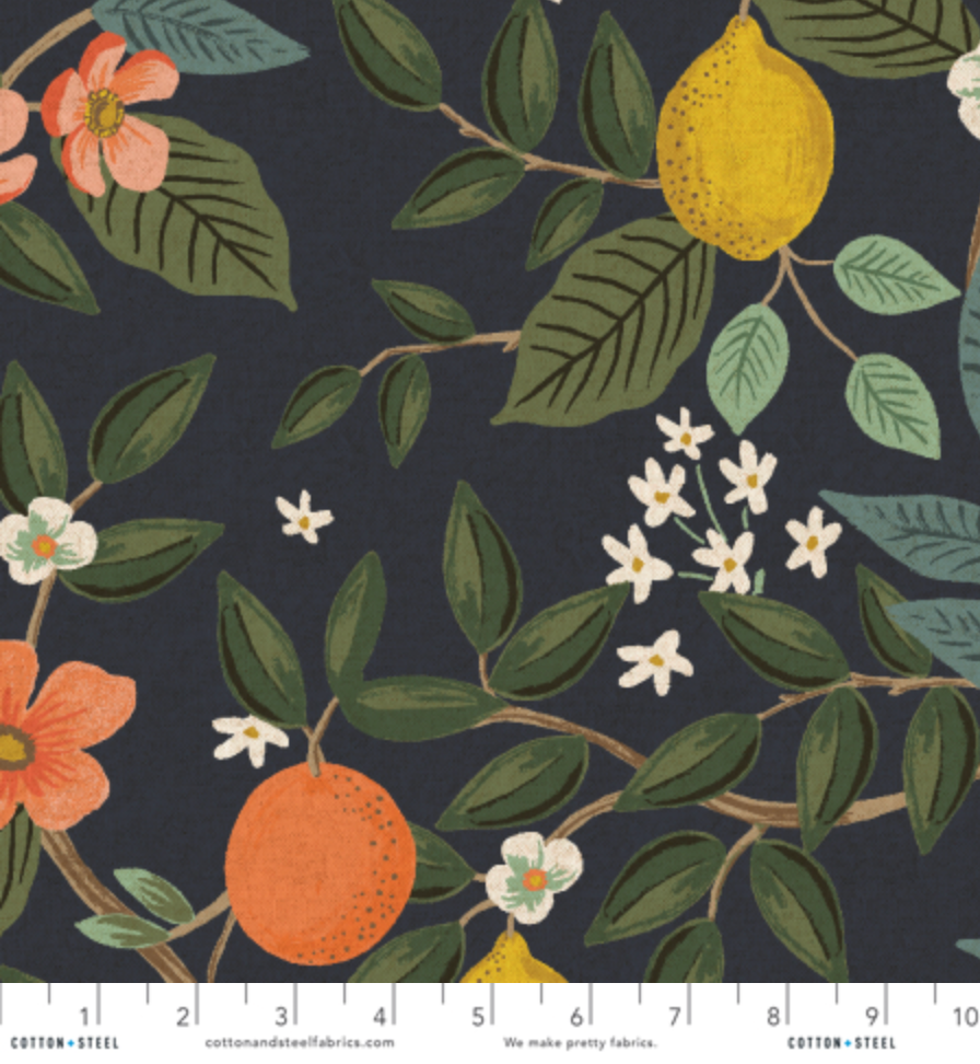Bramble Citrus Grove Navy Unbleached Canvas by Rifle Paper Co. for Cotton + Steel featuring oranges, lemons, blossoms, and green foliage on a navy background.