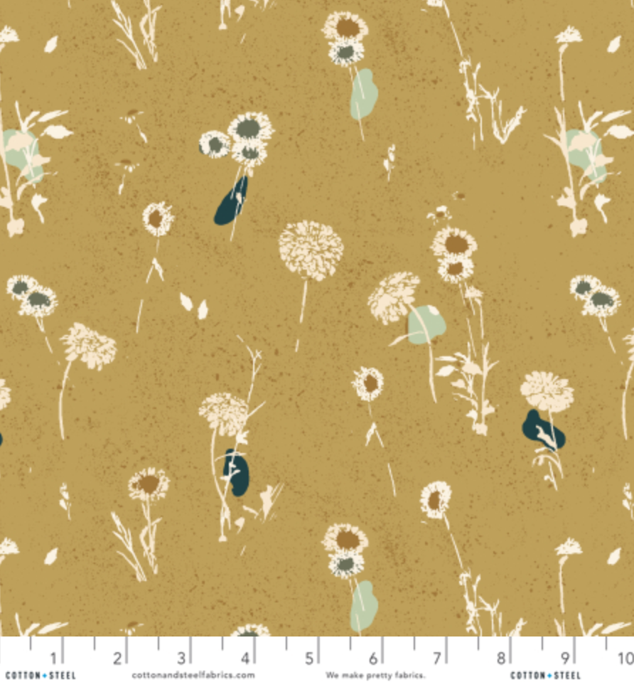 Summer Folk Painted Meadow Honey premium cotton fabric by Lissie Teehee for Cotton + Steel featuring delicate wildflowers, dandelions, and meadow grasses on a warm honey-gold background.