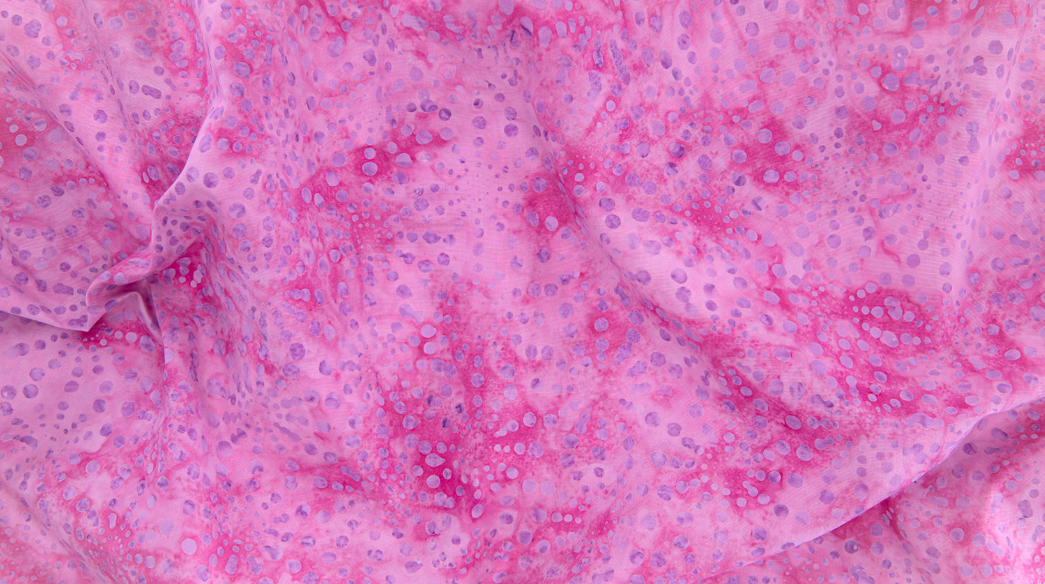 Bursts Rose Batik Fabric by Jinny Beyer – hand-dyed pink cotton batik with subtle bursts from Malam Batiks VIII by RJR Fabrics.