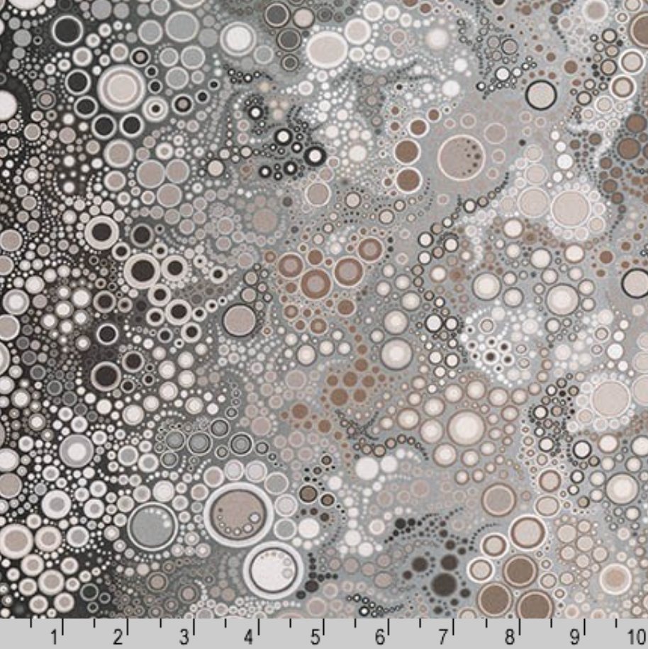 Abstract grey digital print quilting cotton featuring layered circles and bubble-like dots in shades of grey, ivory, taupe, and charcoal by Amelia Caruso for Robert Kaufman.