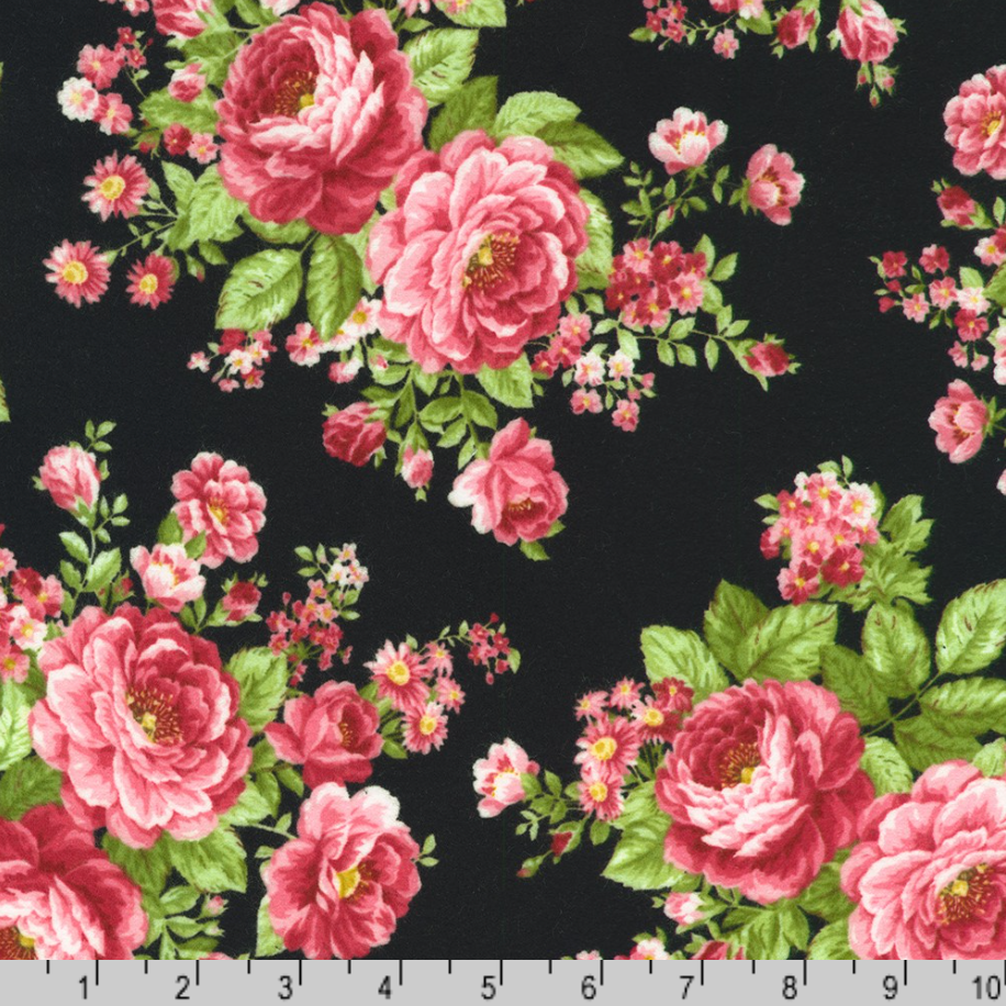Pink rose bouquets with green leaves on black cotton flannel fabric from the Flowerhouse Collection by Debbie Beaves for Robert Kaufman.