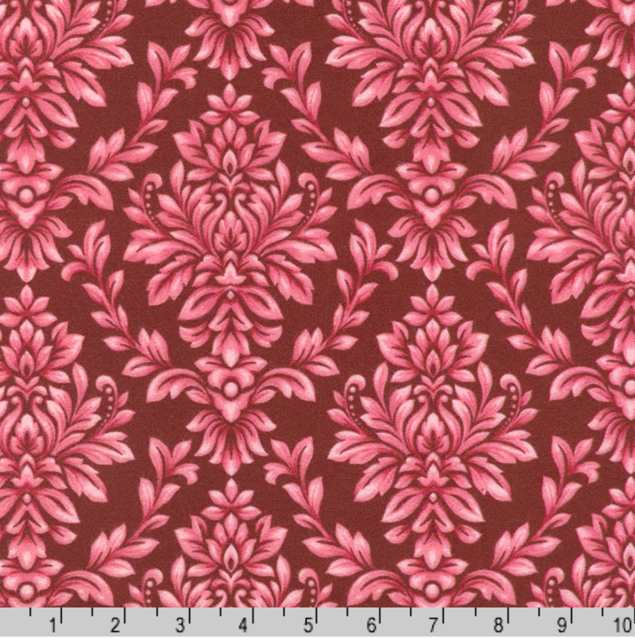 Pink damask leaf scroll pattern on burgundy cotton flannel fabric from the Flowerhouse Collection by Debbie Beaves for Robert Kaufman.