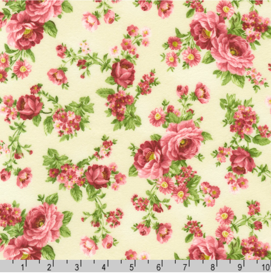 Pink rose bouquets with green leaves on cream cotton flannel fabric from the Flowerhouse Collection by Debbie Beaves for Robert Kaufman.