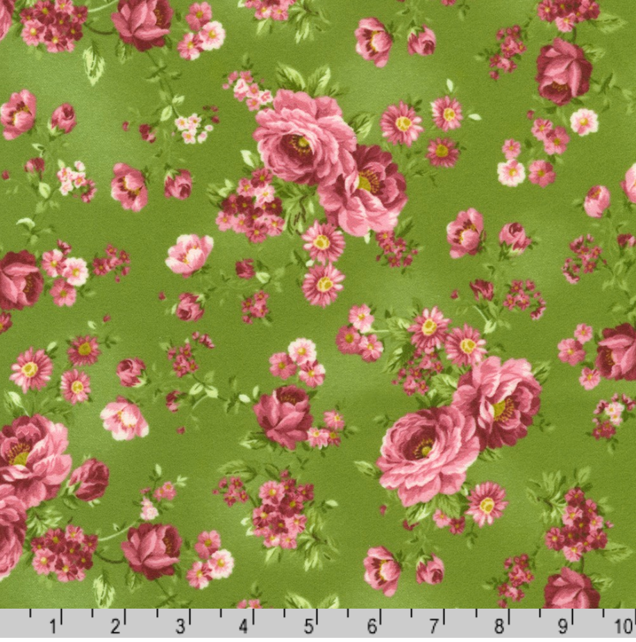 Pink rose bouquets with delicate blossoms on meadow green cotton flannel fabric from the Flowerhouse Collection by Debbie Beaves for Robert Kaufman.