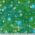 Artisan Batiks Evergreen Ice Sparkle Frosted Snowflakes Emerald batik fabric featuring metallic silver snowflakes and icy blue starbursts on a rich emerald green hand-dyed batik background.