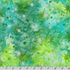Artisan Batiks Evergreen Ice Sparkle Frosted Snowflakes Northern Lights batik fabric featuring silver metallic snowflakes and green starbursts on a turquoise, aqua, and lime green hand-dyed batik background.