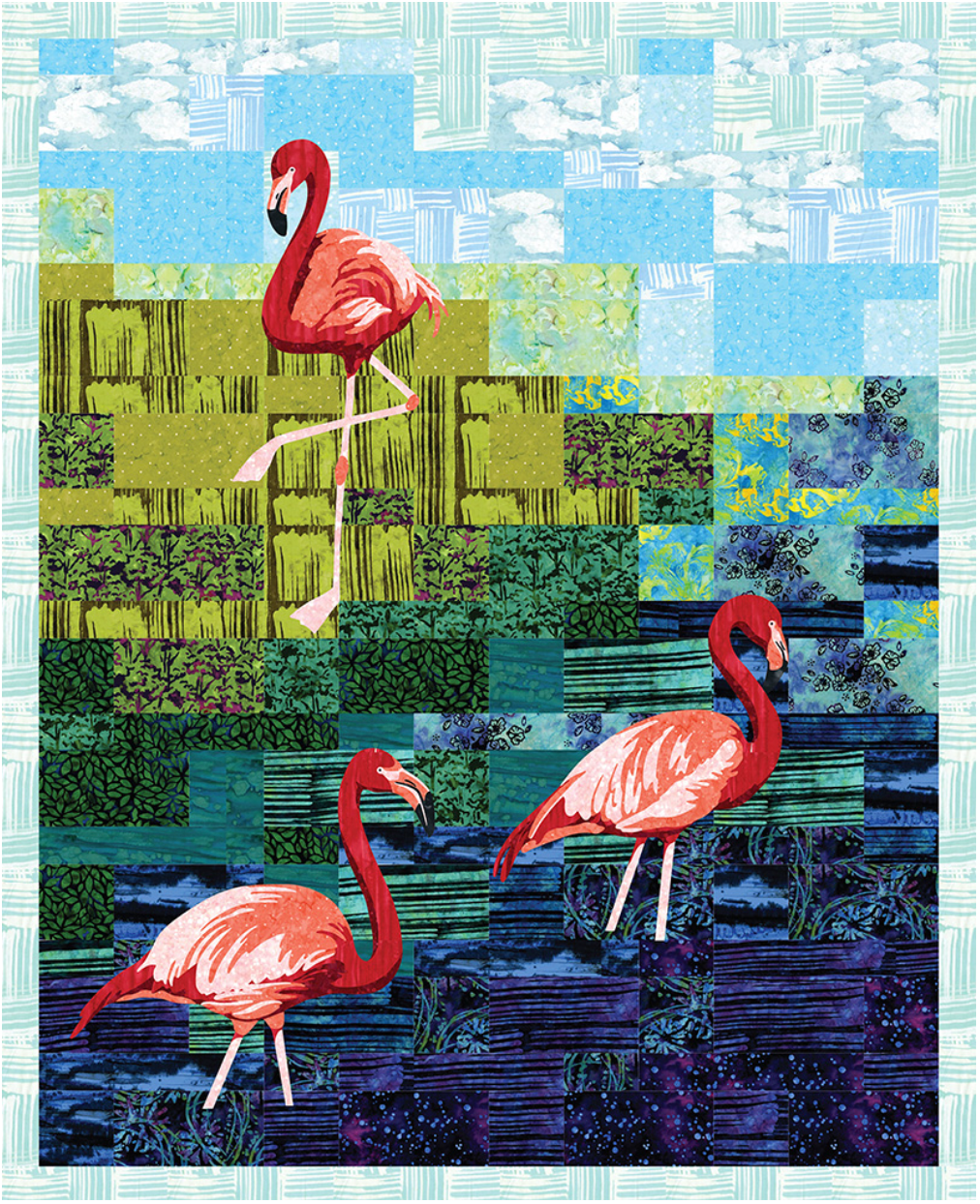 Blossom Batiks Flora Flamingo Quilt Kit by RJR Fabrics featuring three vibrant pink flamingos set against a pieced batik landscape in shades of turquoise, blue, green, and purple with a soft aqua border, perfect for quilting enthusiasts.