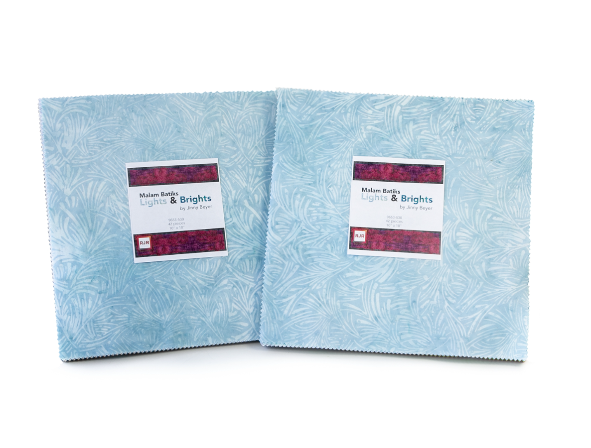 Malam Batiks VI Lights & Brights Patty Cake by Jinny Beyer for RJR Fabrics featuring 42 premium 10-inch hand-dyed batik fabric squares from the complete collection in vibrant blue, green, yellow, orange, pink, purple, and white tones for quilting and sewing.