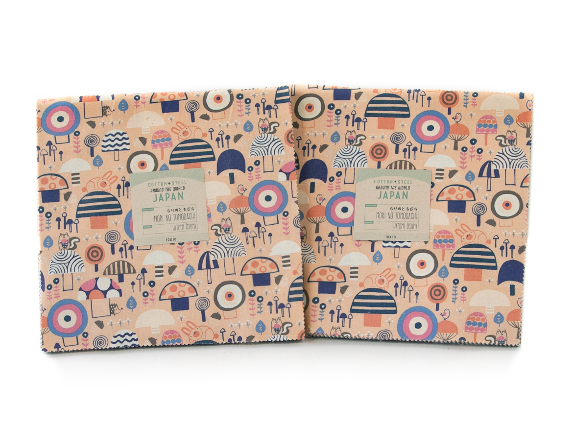 Mori No Tomodachi Layer Cake by Hitomi Osumi featuring 42 coordinating 10-inch unbleached cotton squares with woodland animals, mushrooms and flowers.