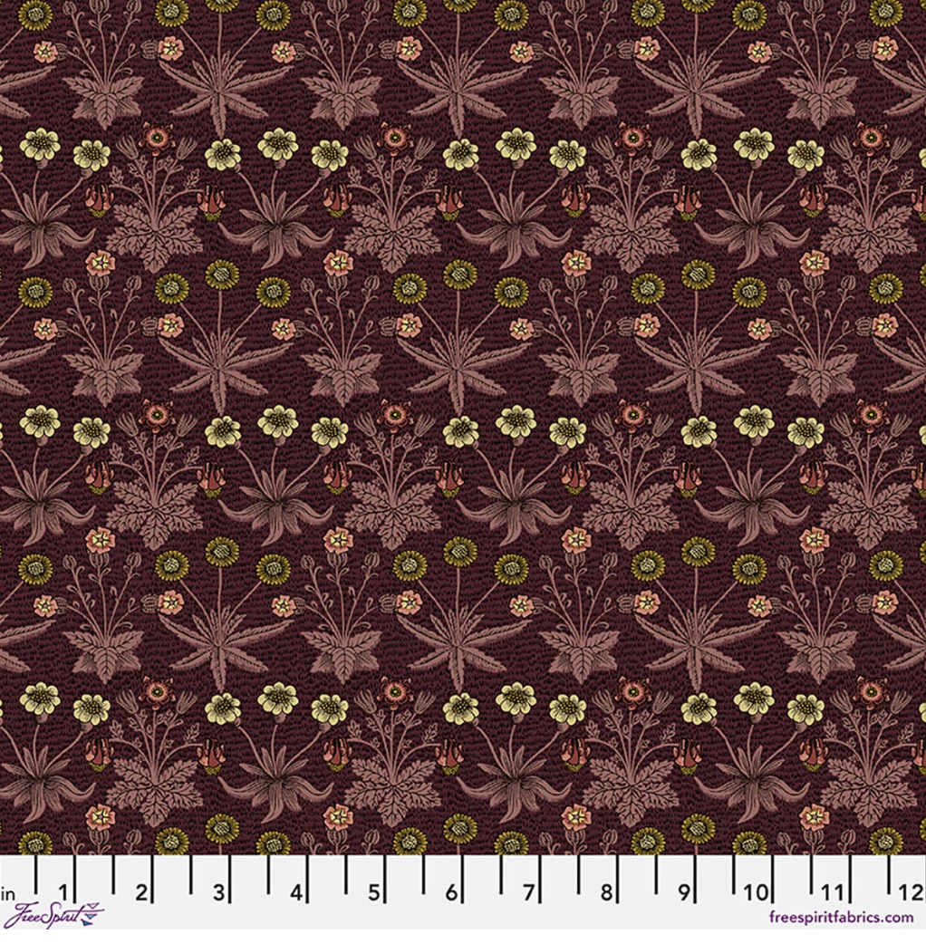 Lodden Daisy Fields Madder fabric by Morris & Co for FreeSpirit, featuring small daisies, flowers, leaves, and botanical motifs in gold, blush, olive, and muted pink on a deep madder background.