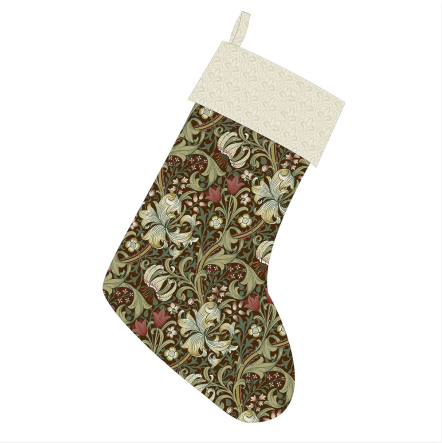 Christmas stocking made with Suffolk Holiday Golden Lily Ruby fabric by Morris & Co, featuring an ornate floral body with a light cream patterned cuff.
