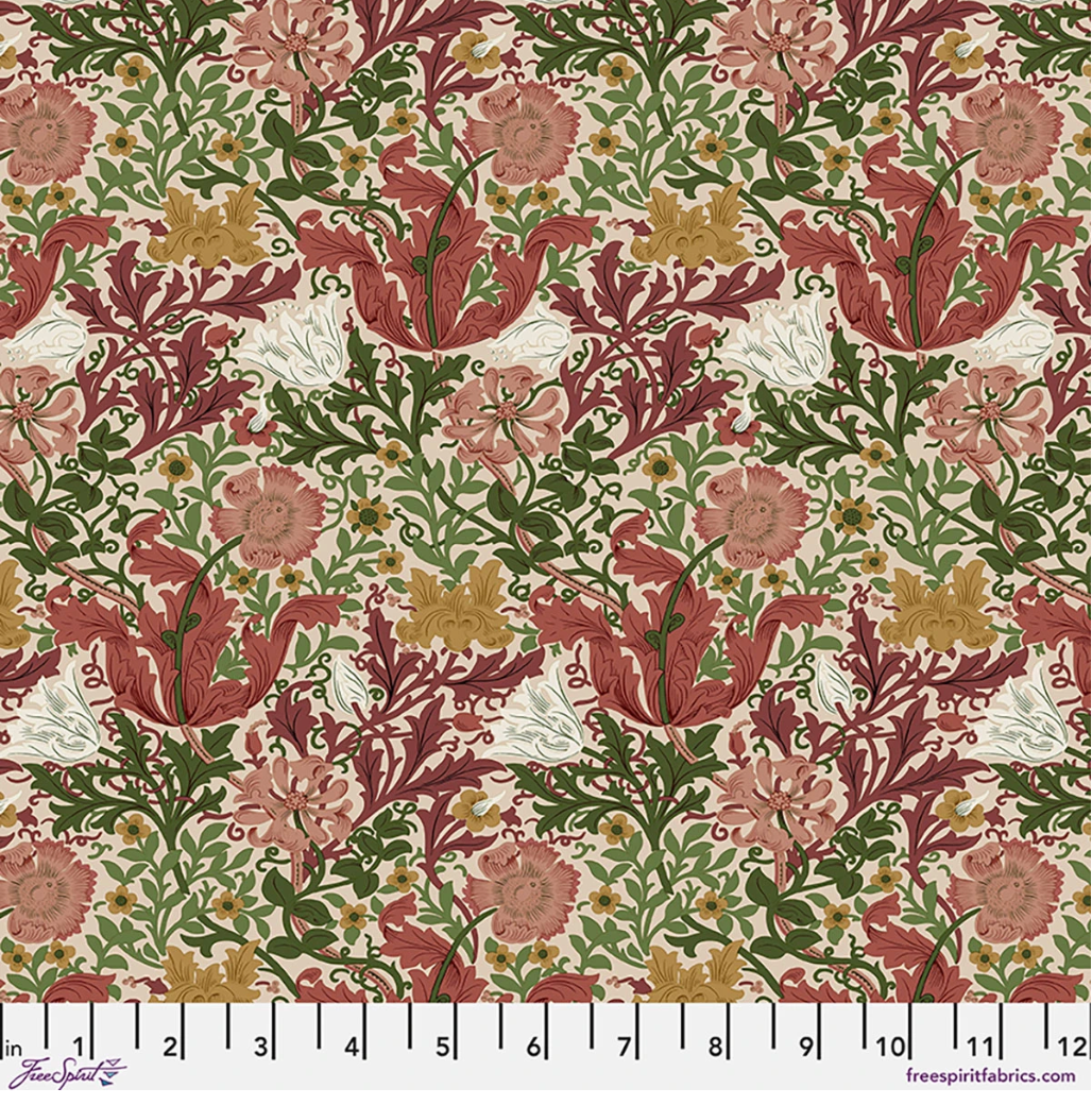 Suffolk Holiday Compton Rose fabric by Morris & Co for FreeSpirit, featuring rose and burgundy flowers, green foliage, cream accents, and warm gold details.