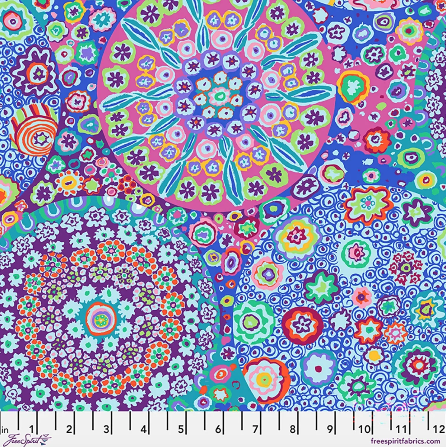 Kaffe Fassett Millefiore Aqua cotton lawn fabric featuring large circular floral motifs in aqua, blue, pink, purple, green, orange, and white.
