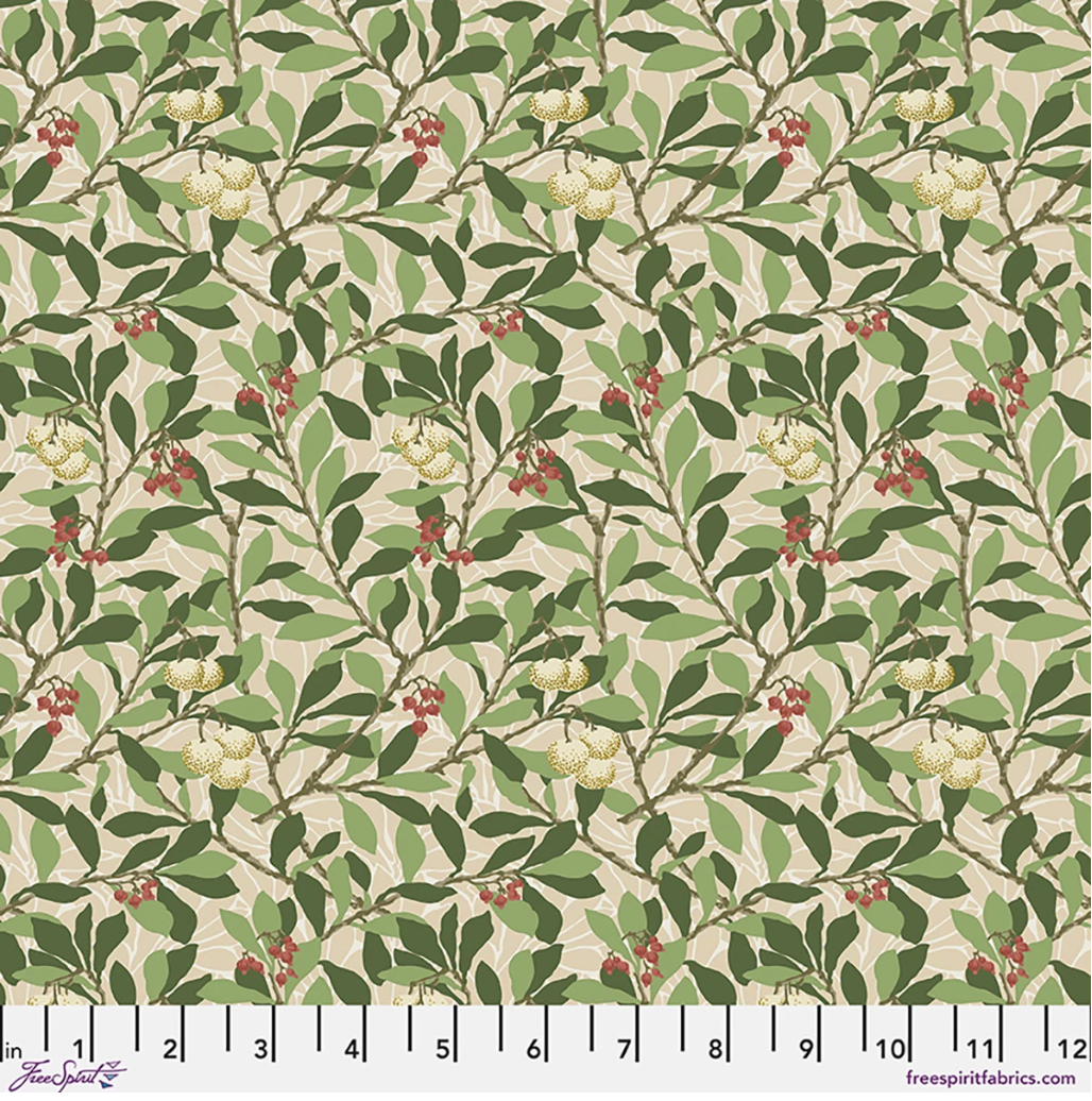 Suffolk Holiday Arbutus Bay fabric by Morris & Co for FreeSpirit, featuring layered green leaves, small red berries, cream fruit motifs, and a warm neutral background.
