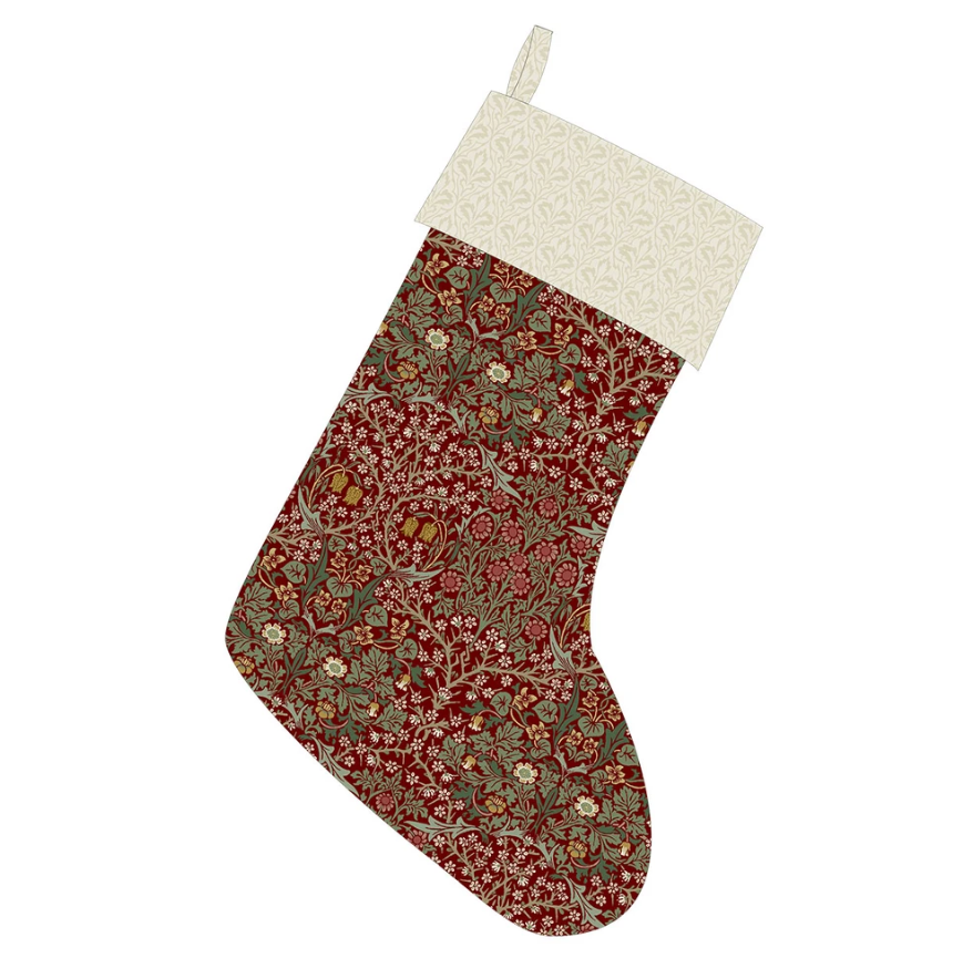 Christmas stocking made with Suffolk Holiday Blackthorn Thorned Rose fabric by Morris & Co, featuring an ornate red floral body with a light cream patterned cuff.