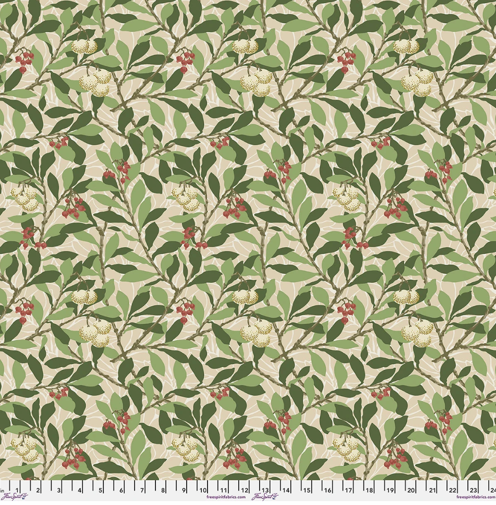 Suffolk Holiday LG Arbutus Bay 108 inch wide quilt backing fabric by Morris & Co, featuring layered green leaves, cream fruit motifs, red berries, and a warm neutral background.