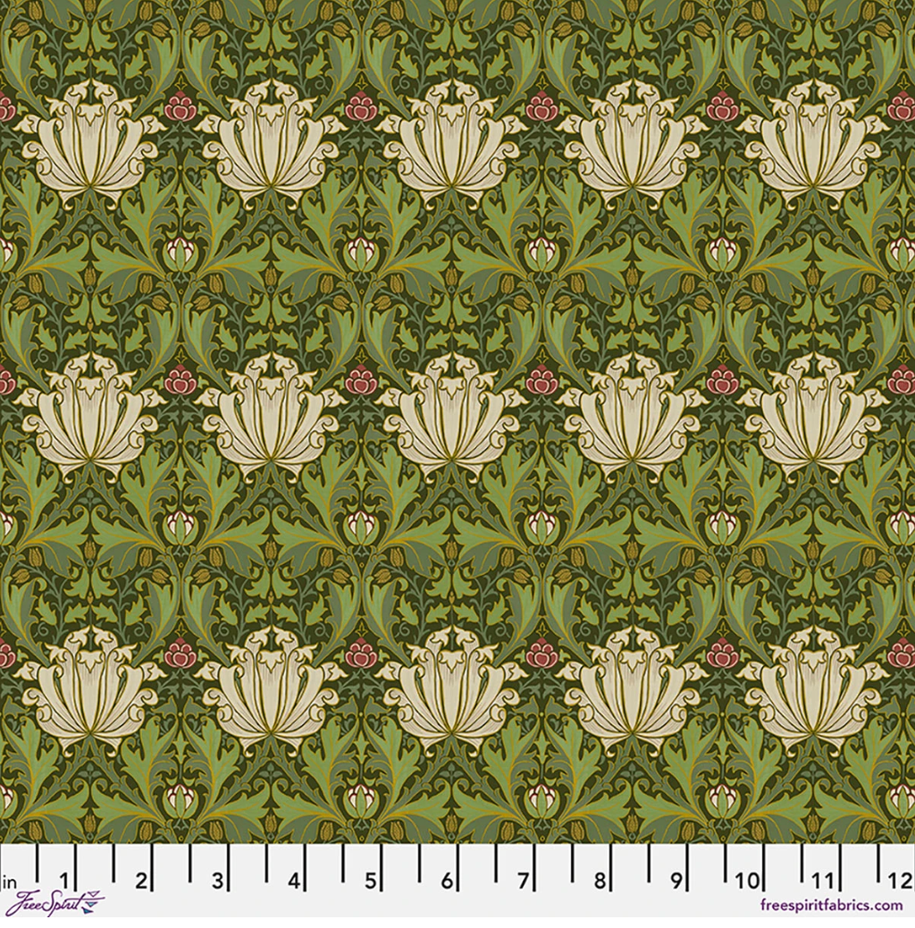 Suffolk Holiday Helena Herball fabric by Morris & Co for FreeSpirit, featuring cream flowers, olive and teal foliage, and muted red accents in a symmetrical botanical pattern.