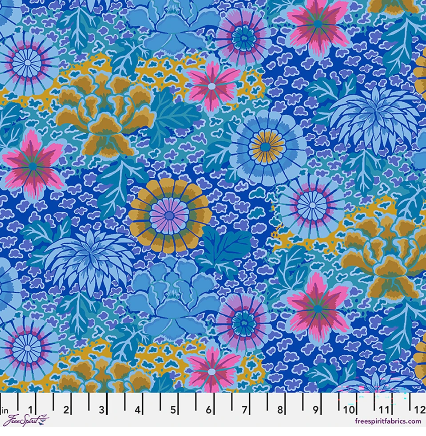 Kaffe Fassett Dream Blue cotton lawn fabric featuring layered blue, aqua, pink, teal, periwinkle, and gold floral motifs.