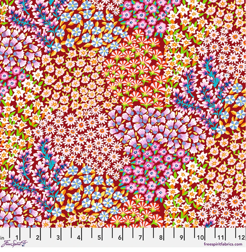 Kaffe Fassett Persian Garden Rust cotton lawn fabric featuring dense floral clusters in rust, red, pink, lavender, aqua, blue, green, cream, and gold.