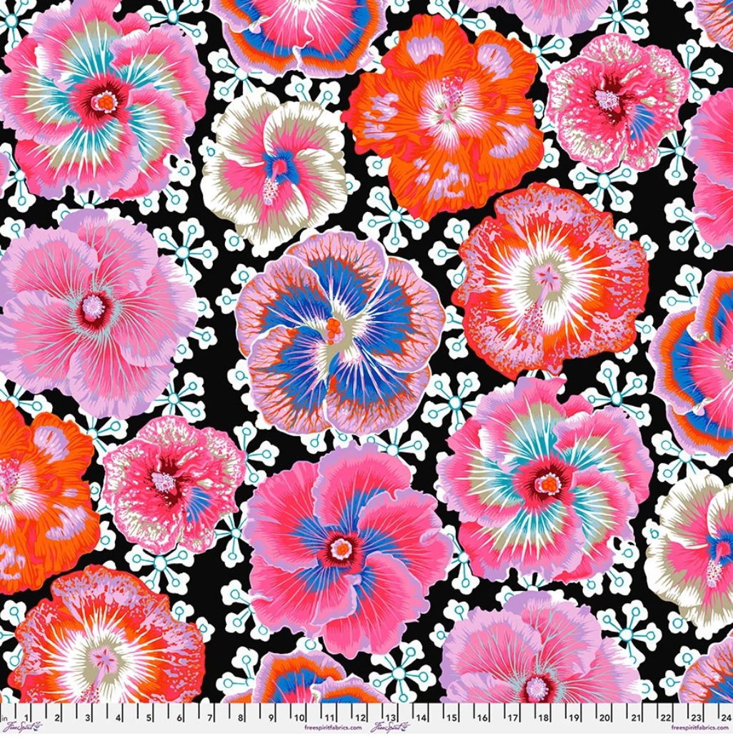 Floating Hibiscus Contrast fabric by Philip Jacobs for Kaffe Fassett Collective, featuring oversized pink, coral, orange, lavender, blue, cream, and red hibiscus flowers on a black background.