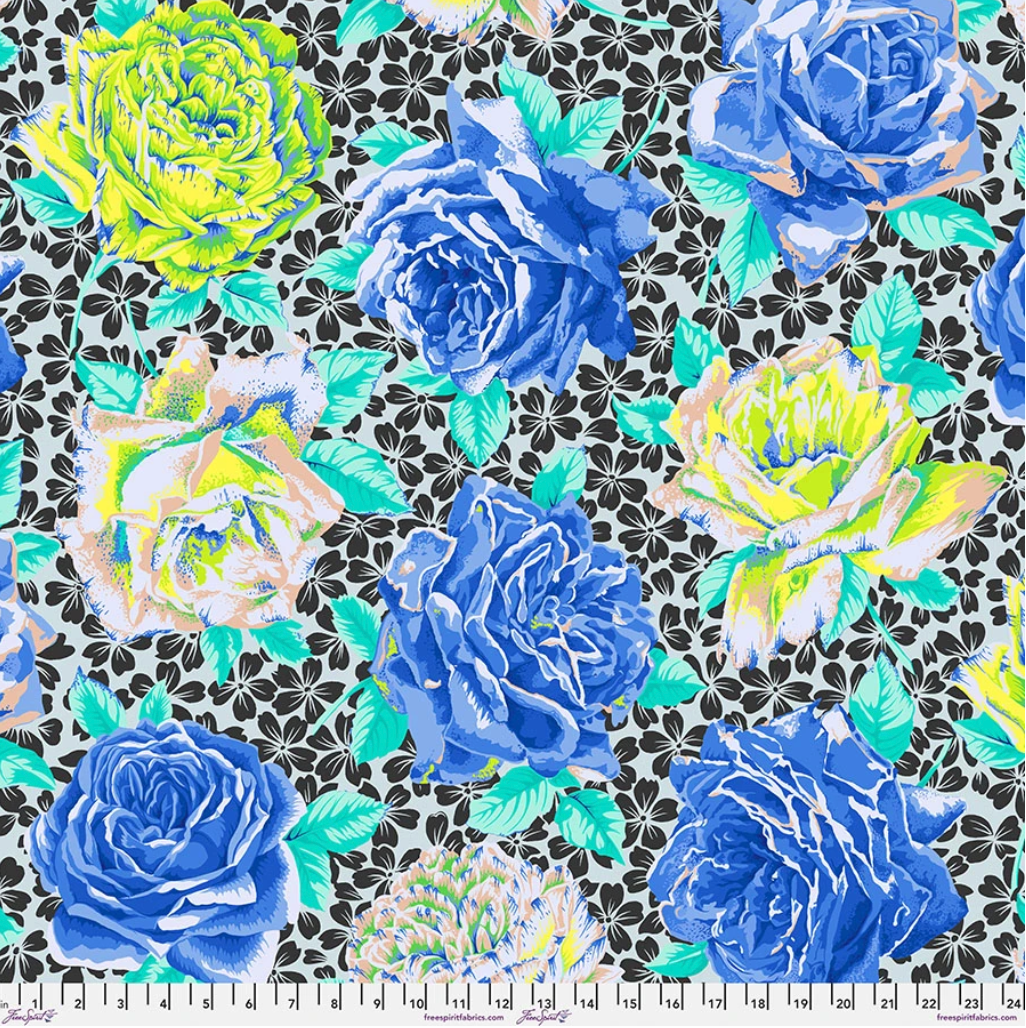 Rose Bloom Blue fabric by Philip Jacobs for Kaffe Fassett Collective, featuring oversized cobalt blue, periwinkle, lime, cream, and peach roses with turquoise leaves on a black-and-white floral background.