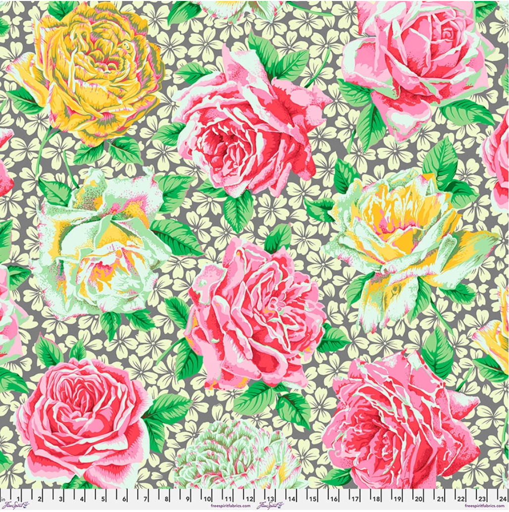 Rose Bloom Grey fabric by Philip Jacobs for Kaffe Fassett Collective, featuring oversized pink, coral, yellow, cream, and mint roses with green leaves on a soft grey floral background.