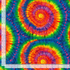 Cassidy Multi Tie-Dye fabric by Timeless Treasures featuring large rainbow spiral tie-dye circles in blue, green, yellow, orange, red, pink, and purple.