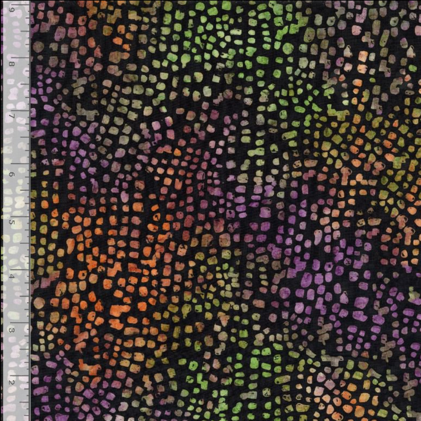 Natural Stone Tiles Raven 108-inch wide batik quilt backing fabric by Timeless Treasures featuring small purple, green, orange, mauve, tan, and gold mosaic shapes on black.