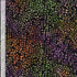 Natural Stone Tiles Raven 108-inch wide batik quilt backing fabric by Timeless Treasures featuring small purple, green, orange, mauve, tan, and gold mosaic shapes on black.